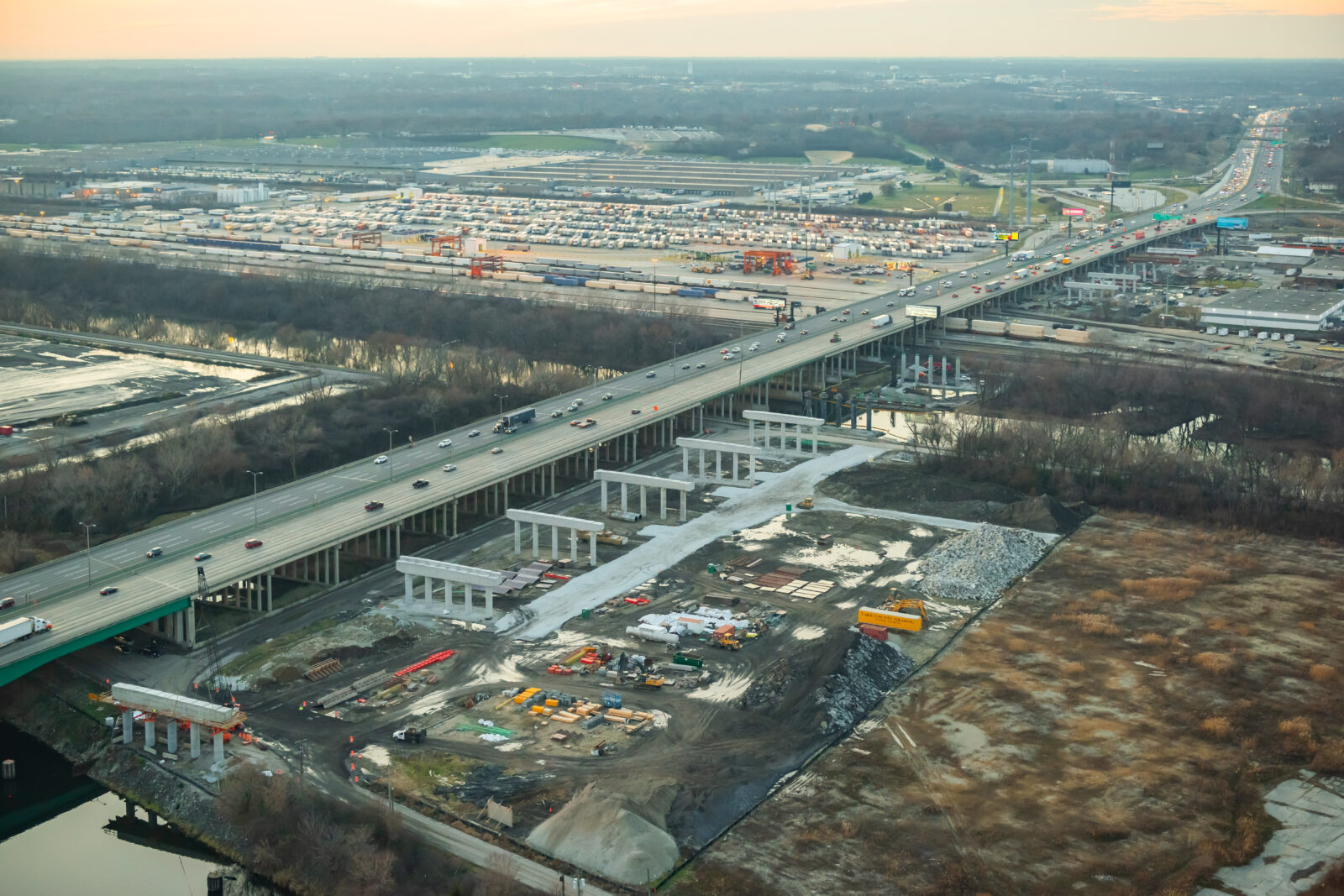 An image of the mile long bridge. Beside it, under construction, are bridge bents waiting to have bridge deck placed on top of them.