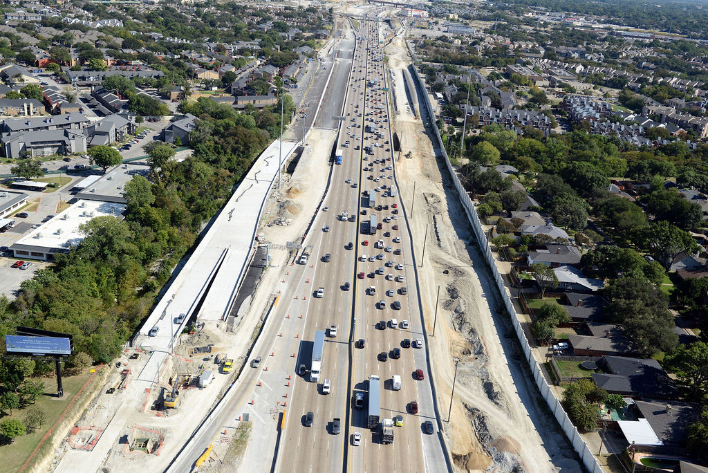 Image of a highway, with construction ongoing next to it.