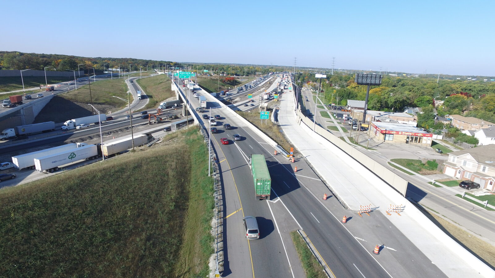 An image of a highway interchange. One of the ramps is under construction.
